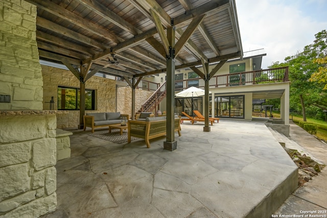 view of patio / terrace featuring ceiling fan and an outdoor hangout area