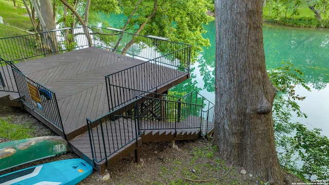 wooden deck with a water view