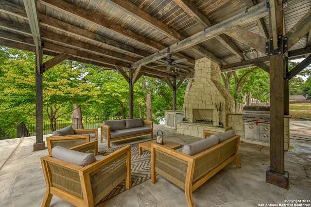 view of patio featuring ceiling fan, grilling area, and an outdoor living space with a fireplace