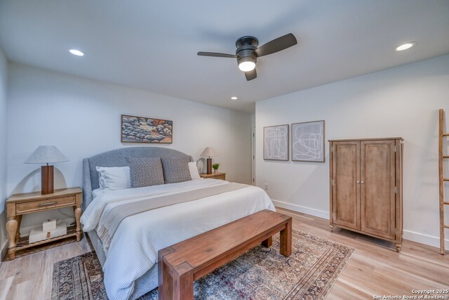 bedroom with ceiling fan and light wood-type flooring