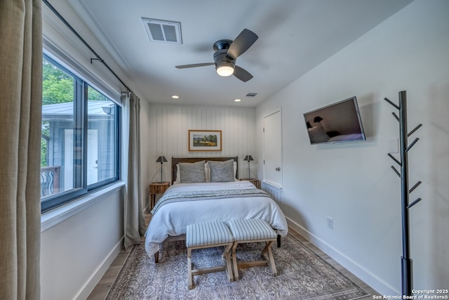 bedroom with wood-type flooring and ceiling fan