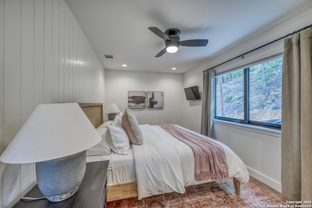 bedroom featuring ceiling fan and hardwood / wood-style floors