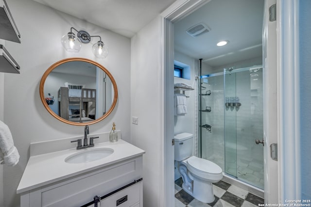 bathroom with vanity, toilet, and walk in shower