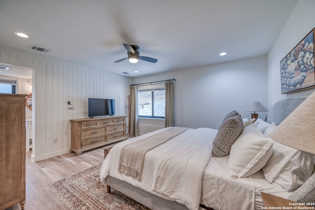 bedroom featuring light hardwood / wood-style floors and ceiling fan