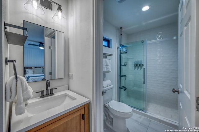 bathroom featuring vanity, toilet, tile patterned flooring, and a shower with door