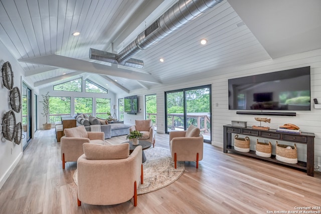 living room featuring wood ceiling, wood walls, light hardwood / wood-style floors, and vaulted ceiling with beams