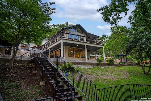 rear view of house with a lawn