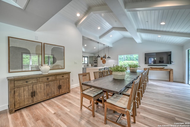 dining area with beam ceiling, high vaulted ceiling, and light wood-type flooring