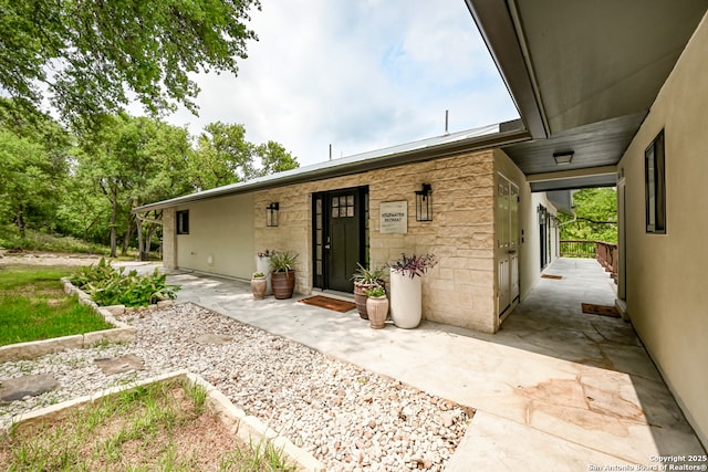 back of house with a patio area