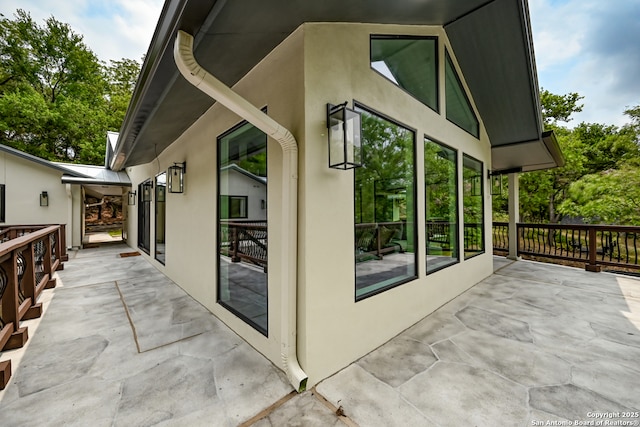 view of side of home with a patio area