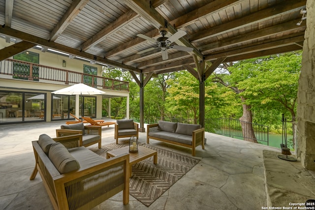 view of patio featuring ceiling fan, an outdoor living space, and a balcony