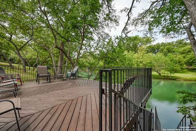 deck featuring a water view