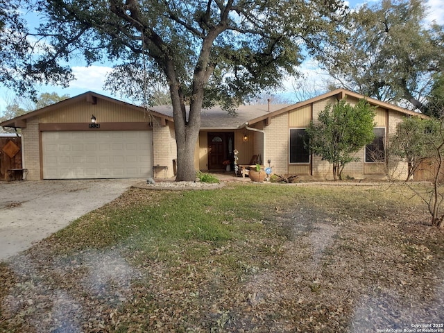 ranch-style house with a garage and a front lawn