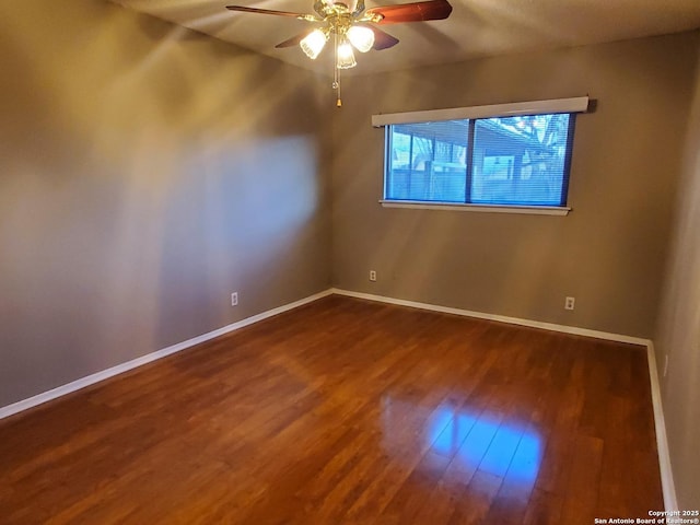 spare room with hardwood / wood-style flooring and ceiling fan