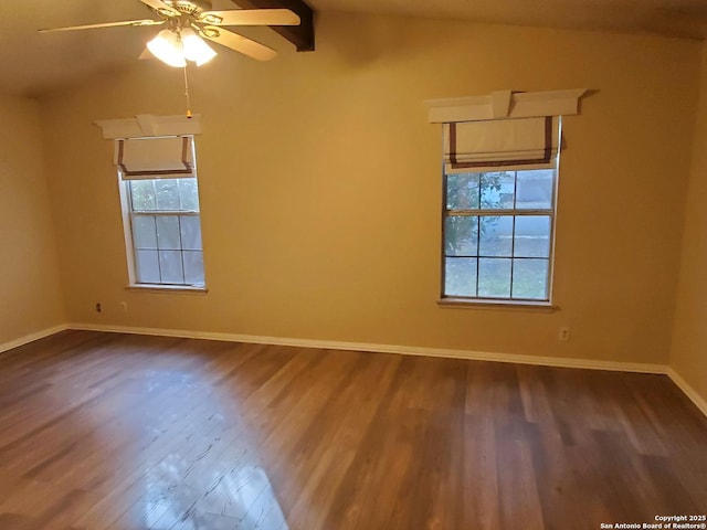 unfurnished room featuring vaulted ceiling with beams, ceiling fan, hardwood / wood-style floors, and a wealth of natural light