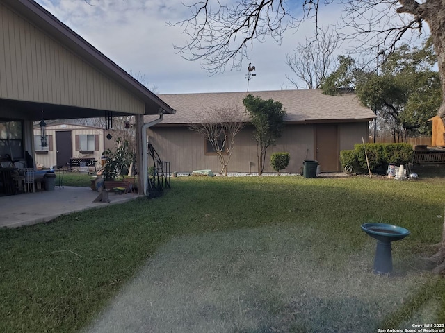 exterior space with a lawn and a patio area