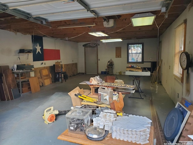 interior space featuring a garage door opener and a workshop area