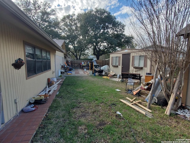 view of yard with an outdoor structure and a patio area