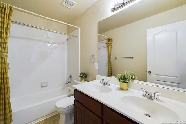 full bathroom with vanity, toilet, and shower / tub combo