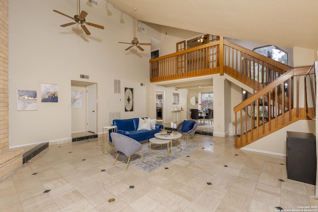 living room featuring a towering ceiling and light tile patterned floors