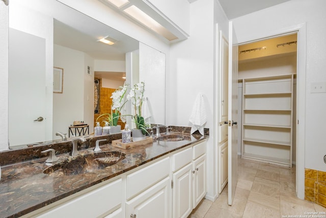 bathroom featuring vanity and tile patterned flooring