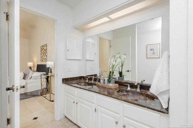 bathroom with tile patterned floors and vanity