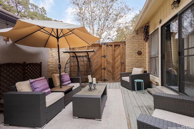 wooden terrace featuring an outdoor living space