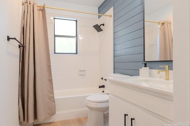 full bathroom with vanity, wooden walls, toilet, shower / tub combo with curtain, and hardwood / wood-style flooring