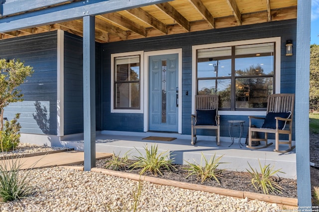 doorway to property with covered porch