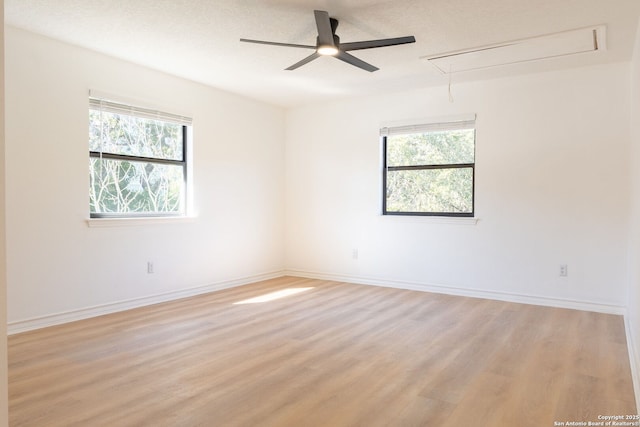 unfurnished room featuring ceiling fan and light hardwood / wood-style flooring