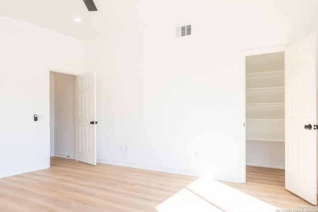 spare room with light hardwood / wood-style floors and ceiling fan