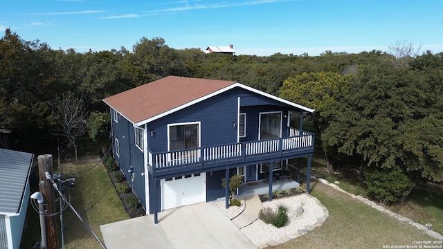 view of front of house with a garage and a front lawn