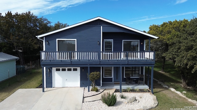 view of front of home with a garage and a patio area