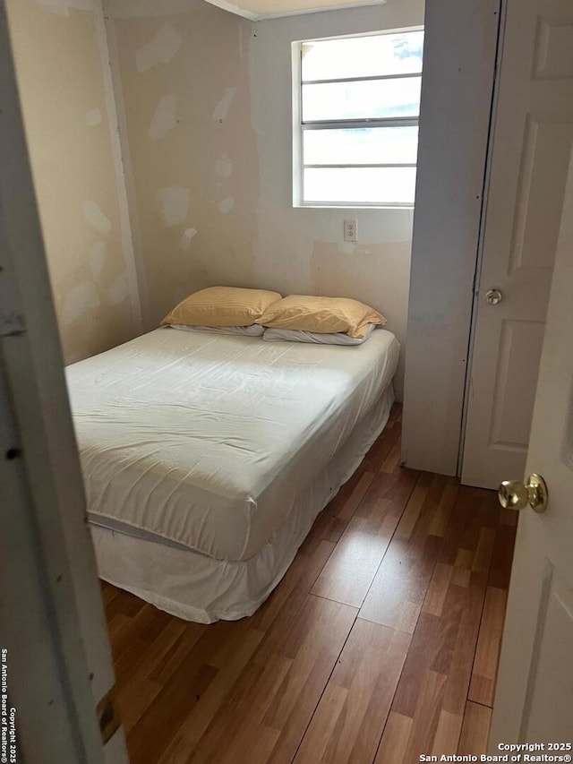 bedroom featuring wood-type flooring