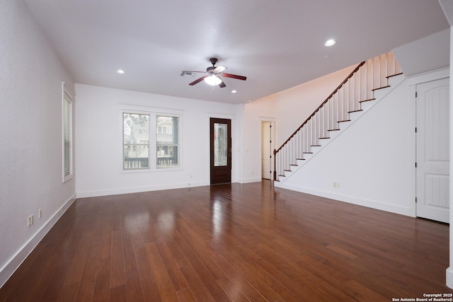 unfurnished living room with dark hardwood / wood-style floors and ceiling fan