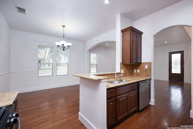 kitchen with dishwasher, sink, dark hardwood / wood-style flooring, dark brown cabinetry, and a healthy amount of sunlight