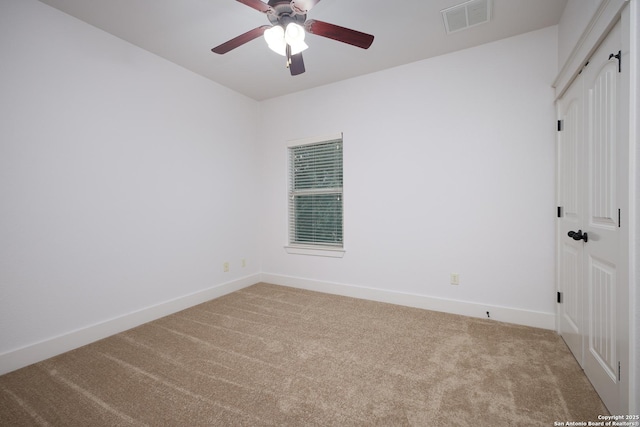 unfurnished room with carpet floors and ceiling fan