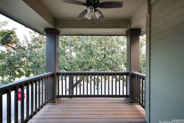 wooden terrace featuring ceiling fan