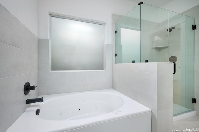 bathroom with shower with separate bathtub