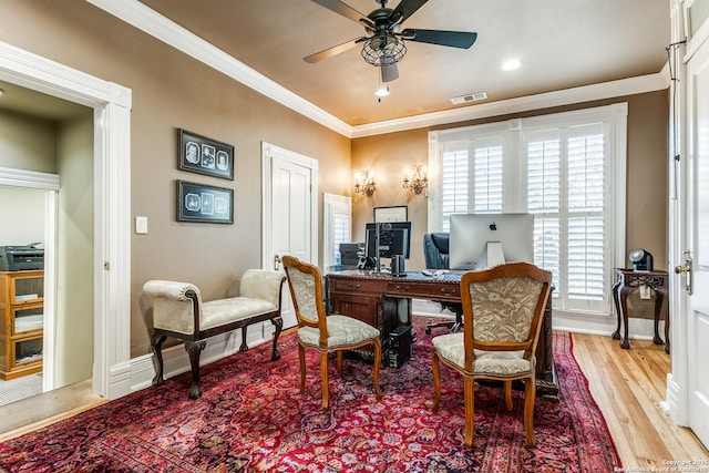 office with ceiling fan, crown molding, and light hardwood / wood-style floors