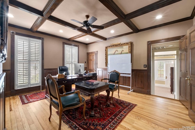 home office with light hardwood / wood-style flooring, ceiling fan, ornamental molding, coffered ceiling, and beamed ceiling