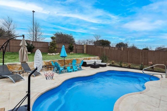 view of swimming pool with an outdoor living space and a patio area