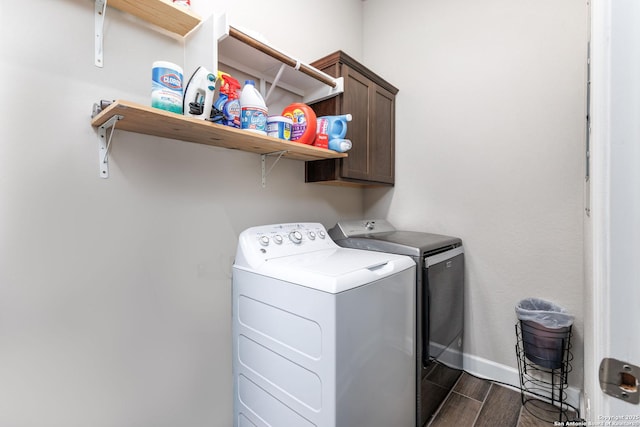 laundry area featuring cabinets and independent washer and dryer