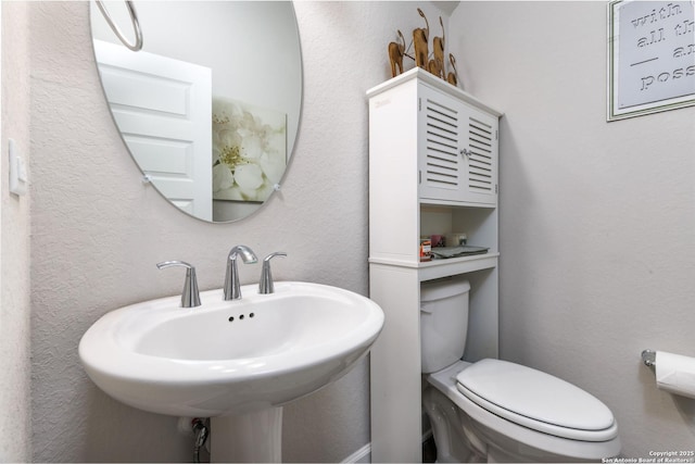 bathroom with sink and toilet