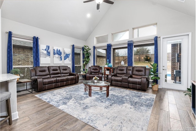 living room featuring high vaulted ceiling and ceiling fan