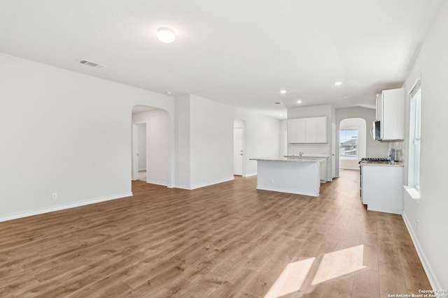 unfurnished living room featuring light hardwood / wood-style flooring