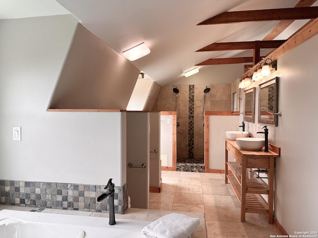 bathroom with a tile shower, vaulted ceiling with beams, vanity, and tile patterned flooring