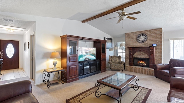 living area featuring vaulted ceiling with beams, light colored carpet, a fireplace, and a textured ceiling