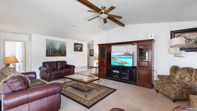 living area with light colored carpet, vaulted ceiling with beams, a textured ceiling, and ceiling fan