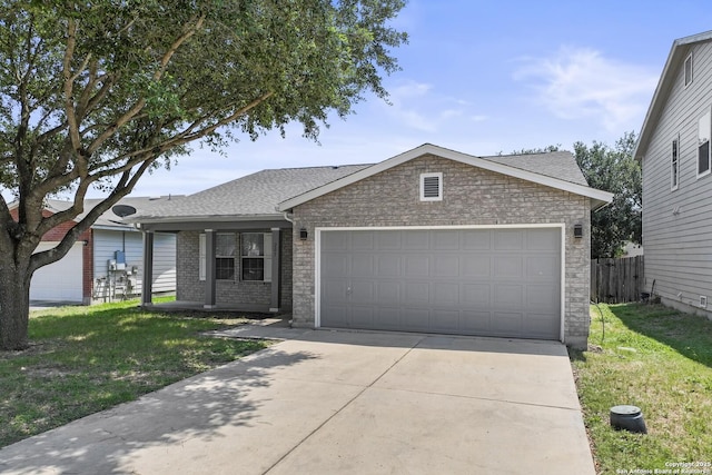 ranch-style house with a garage and a front yard